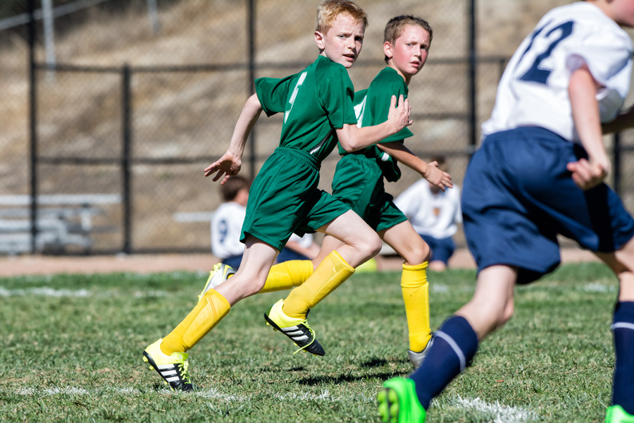 Tobias running soccer photo