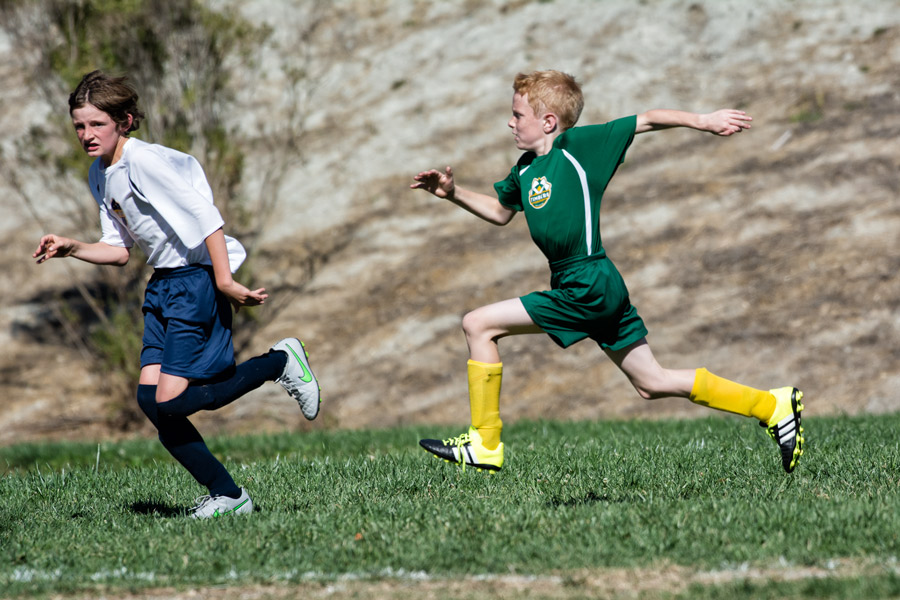 Tobias running soccer photo