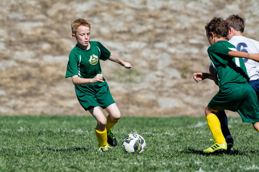 Tobias running soccer photo