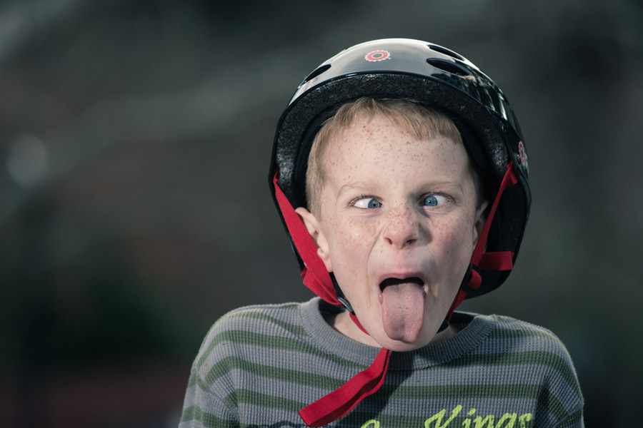 Kid crazy crosseyed with bike helmet photo