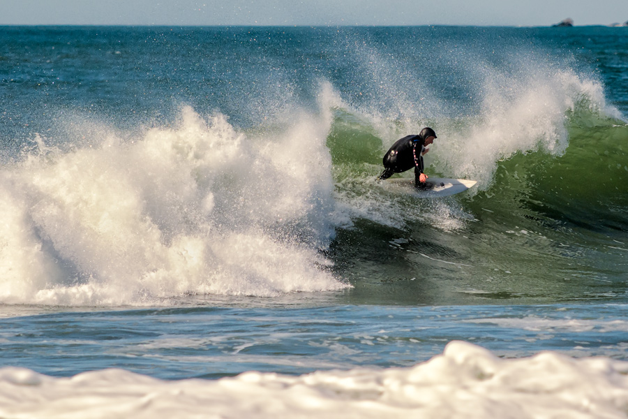 Surfer in wetsuit with wave Half Moon Bay photo
