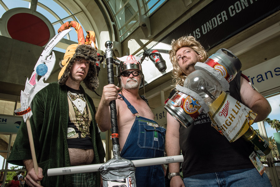 Bengal cat sticking head through blinds photo