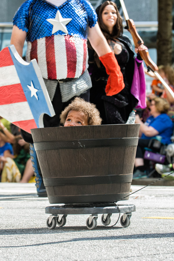 Kid in barrel in dragoncon parade photo