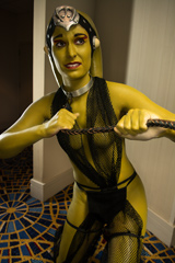 Green Twi'lek pulled by Jabba the Hutt cosplay photo
