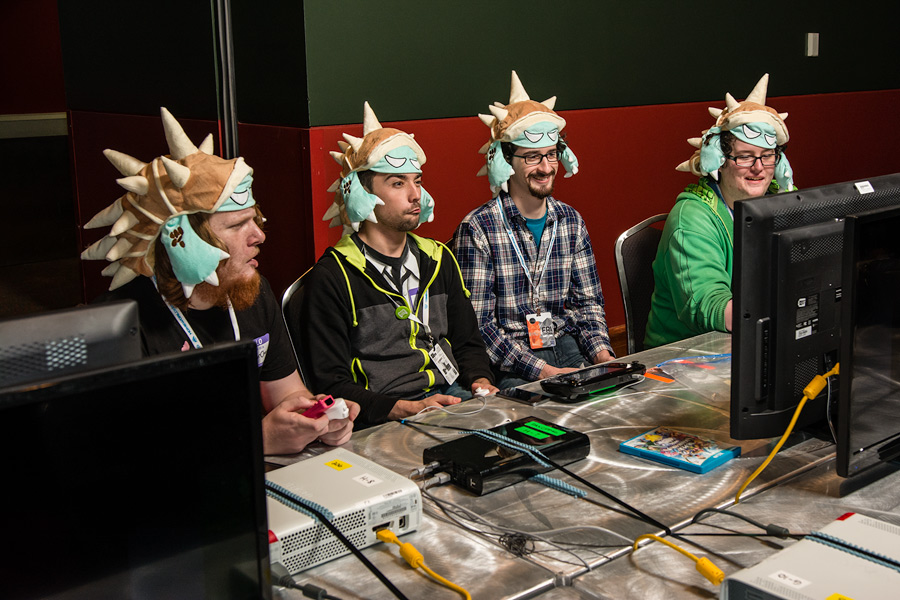 A picture of four guys playing a game at PAX South 2015!